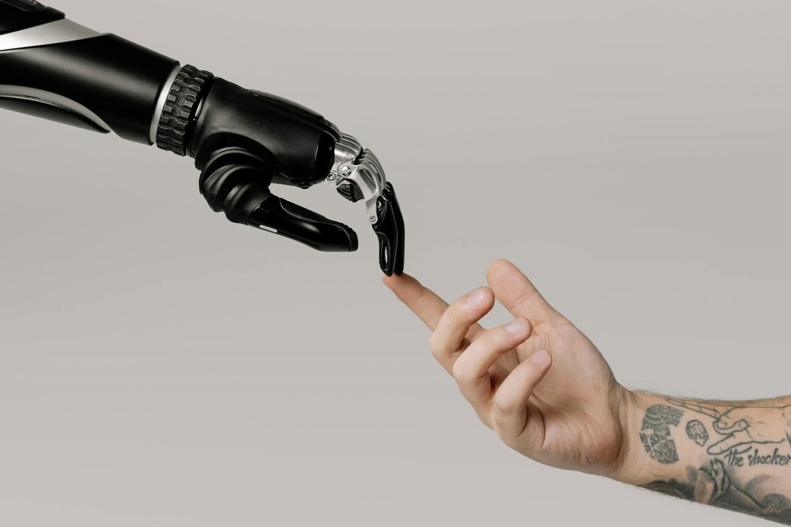 Humand hand and robot hand touching with fingers